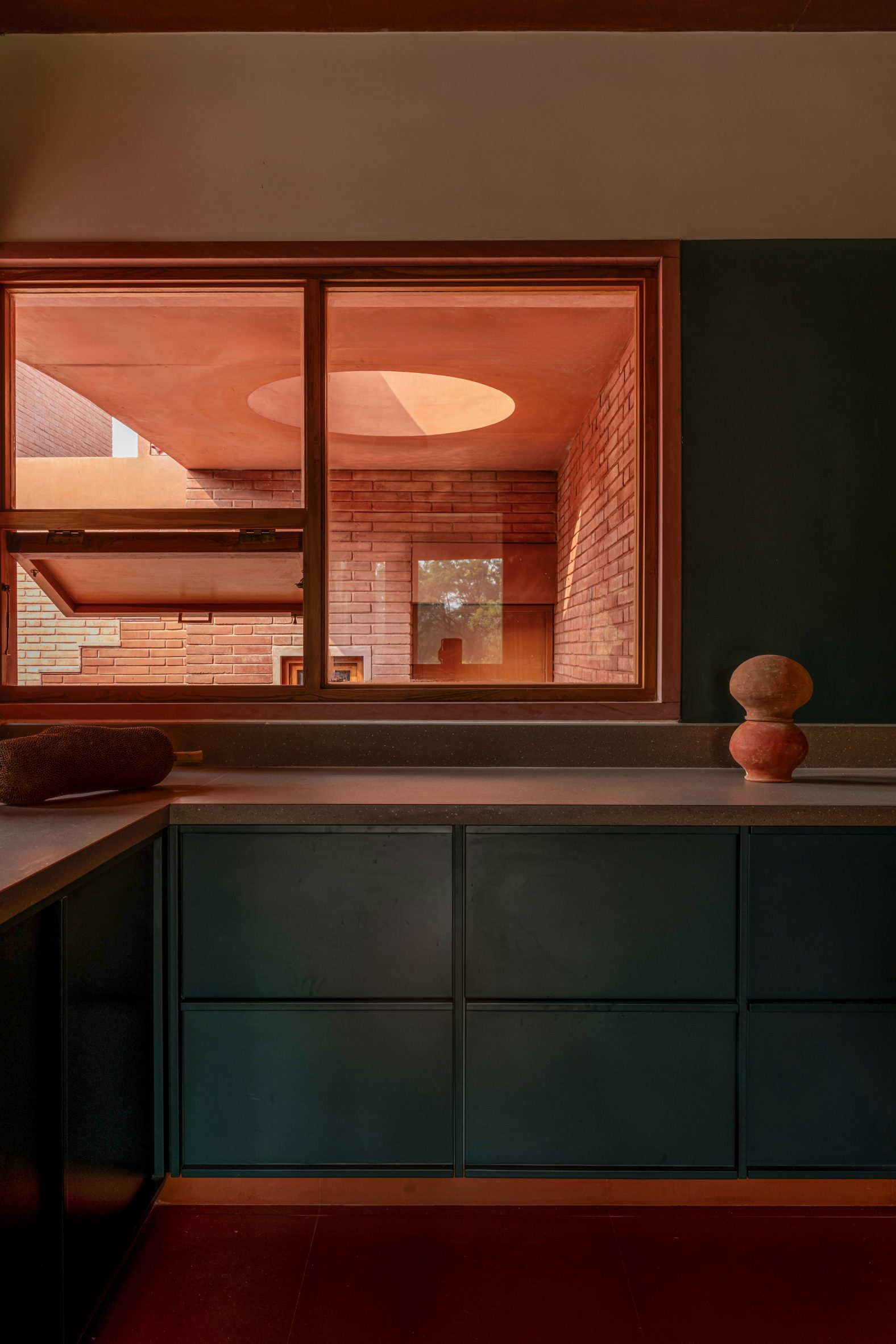 Kitchen in terracotta-coloured house