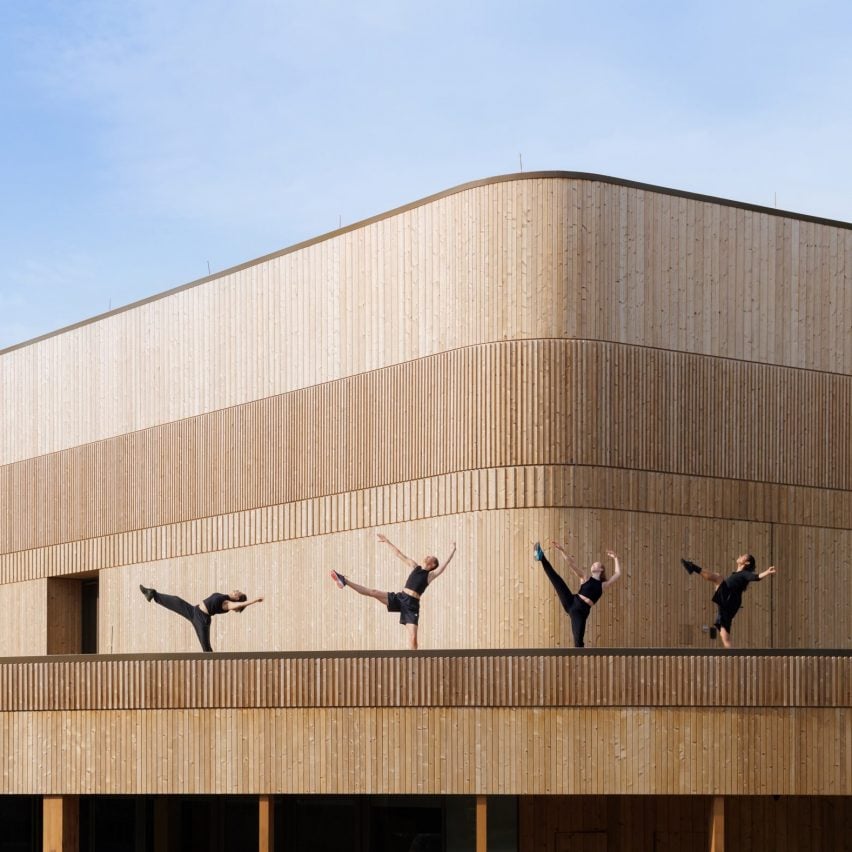 Wooden dancers on terrace of theatre