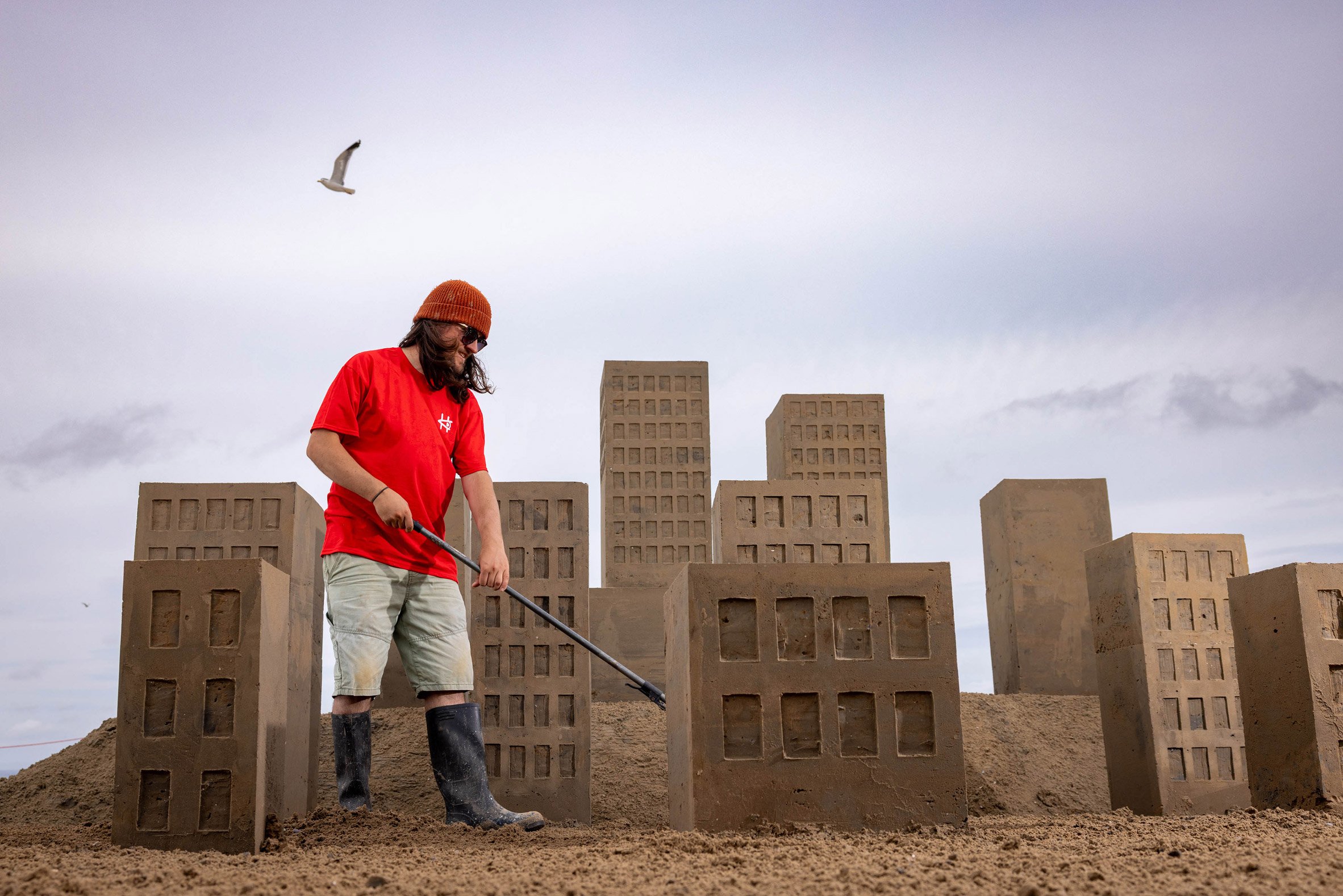 Man building sand towers