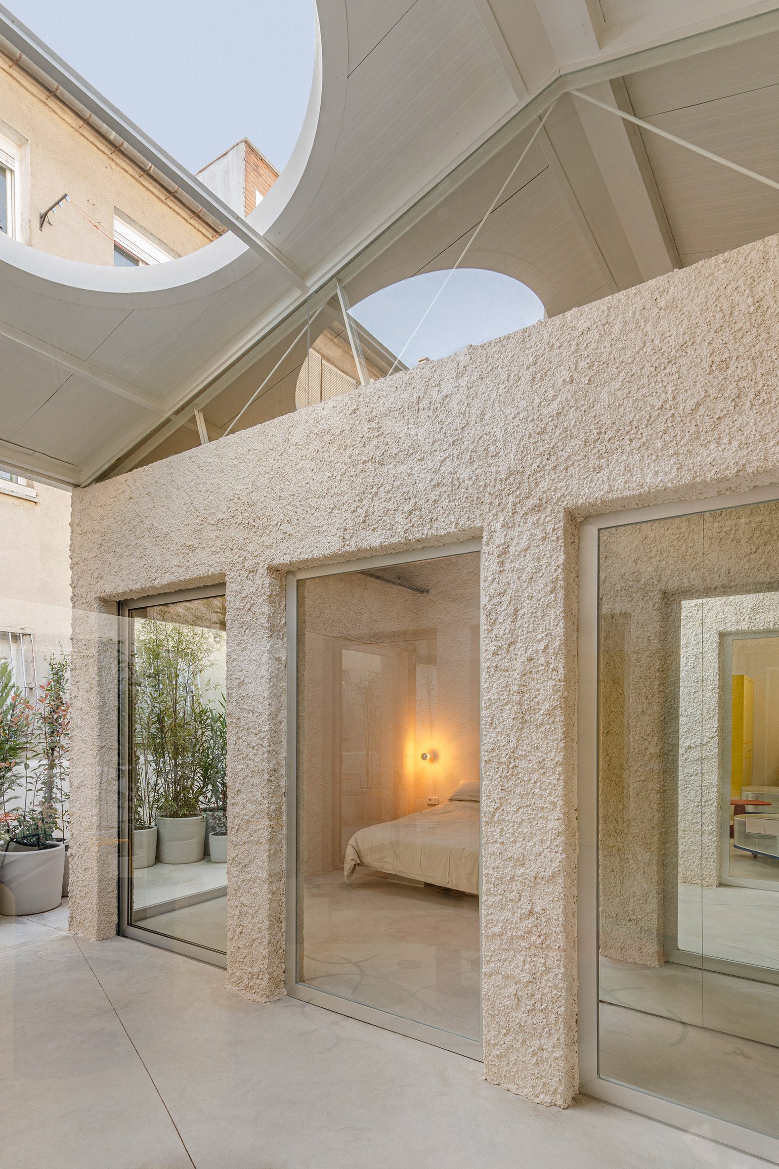 View towards private bedroom within Madrid warehouse conversion by Burr Studio