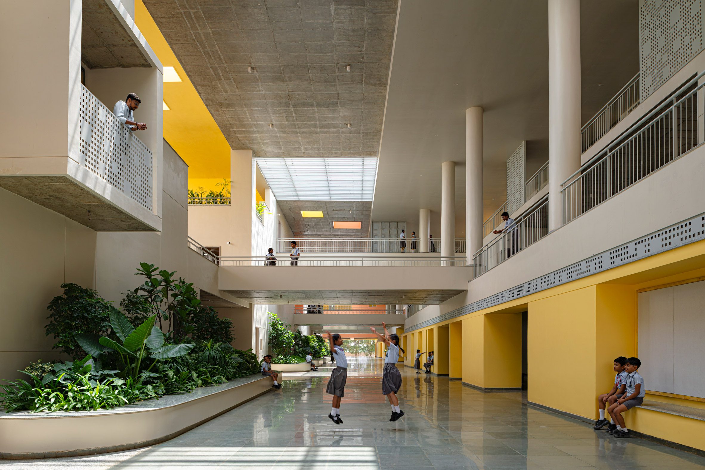 Children playing at the Rainbow International School by Spacefiction Studio