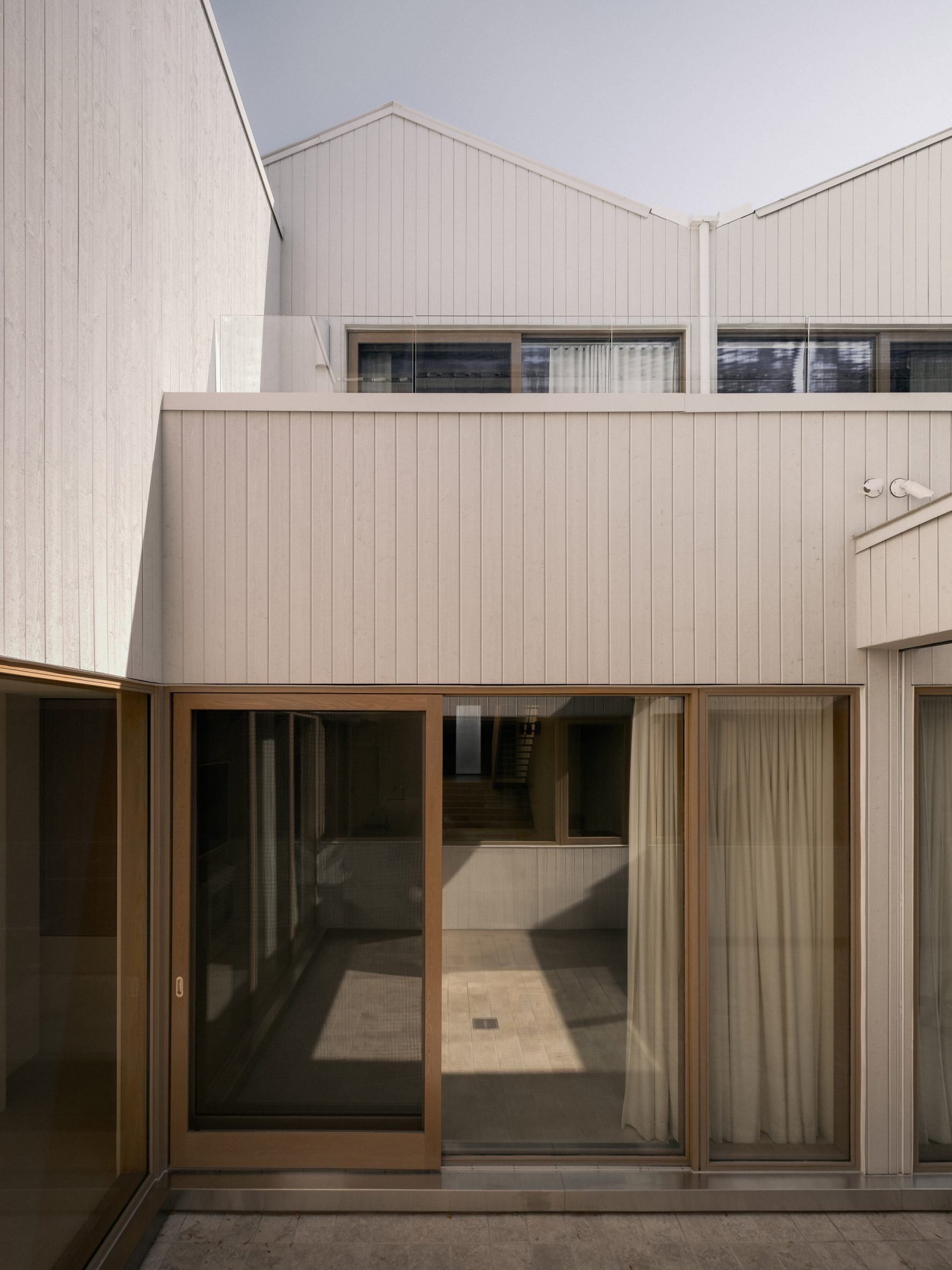 Courtyard in pale cedar building in Toronto