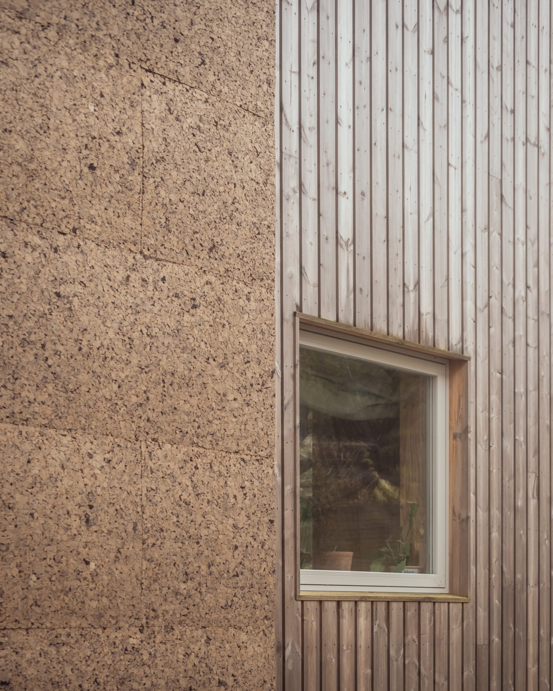 View of cork and plywood exterior of Meadow Road by Studio Bark