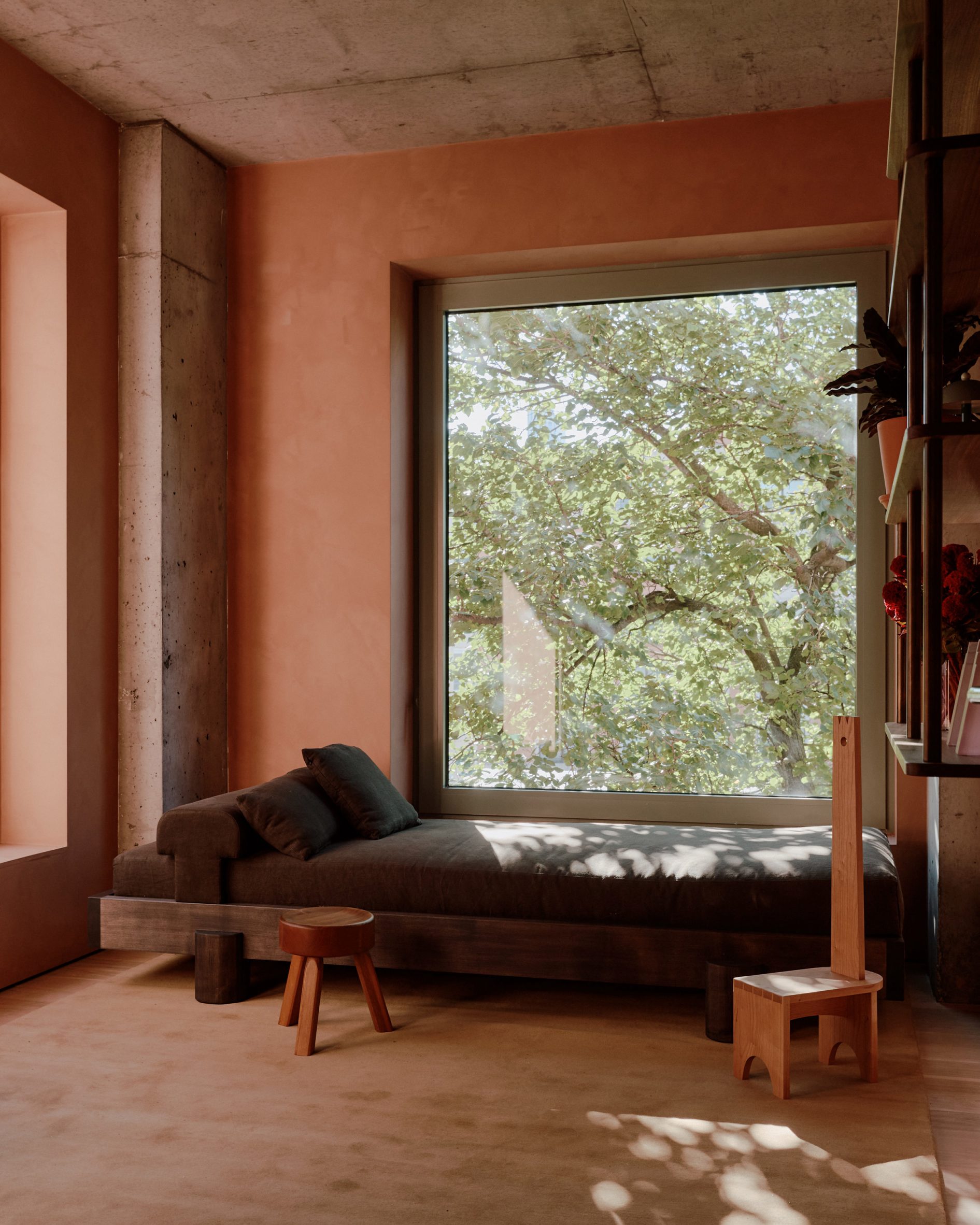 Picture window with day bed and stool in front of it