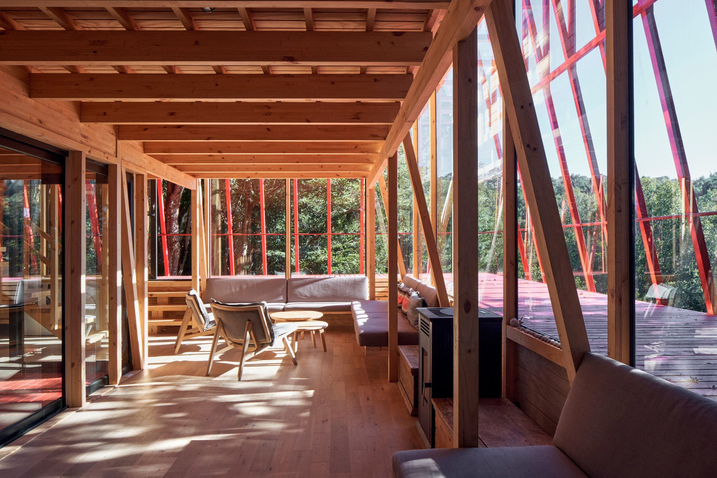 Living room with build in sofa and red structure outside window