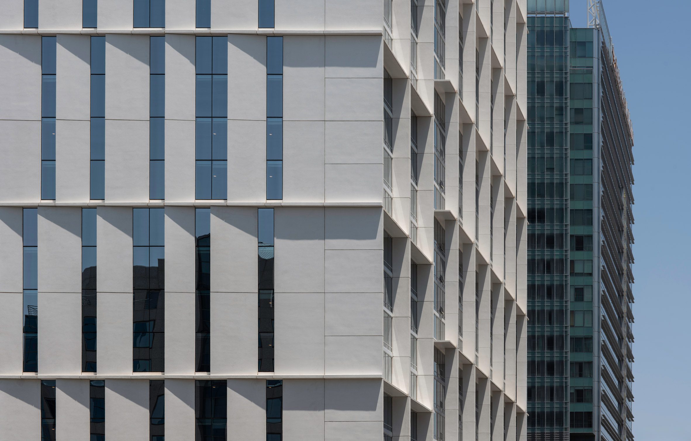 High-rise building with white external louvres