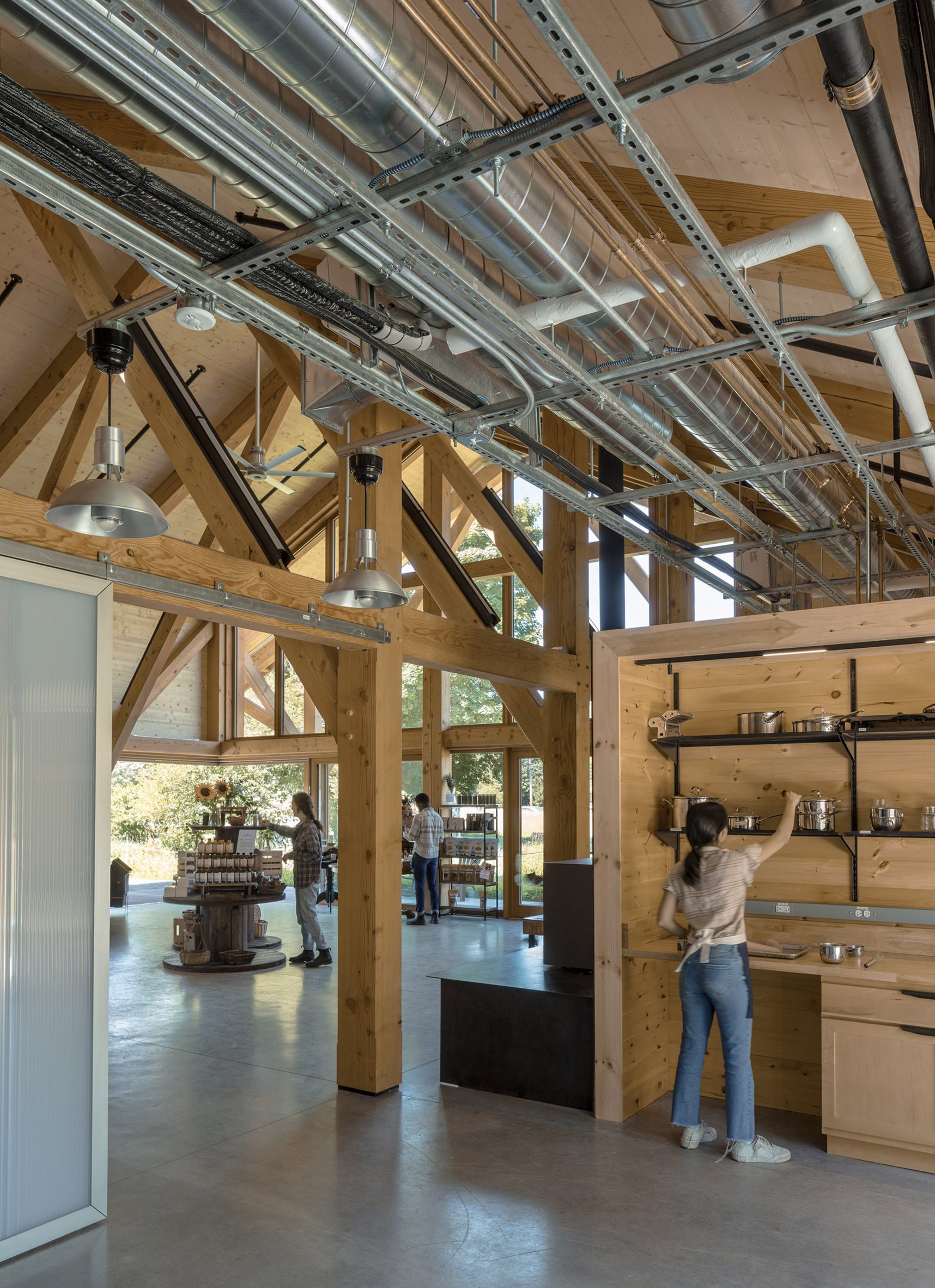 Metal ducting inside of wooden farm stand by Payette