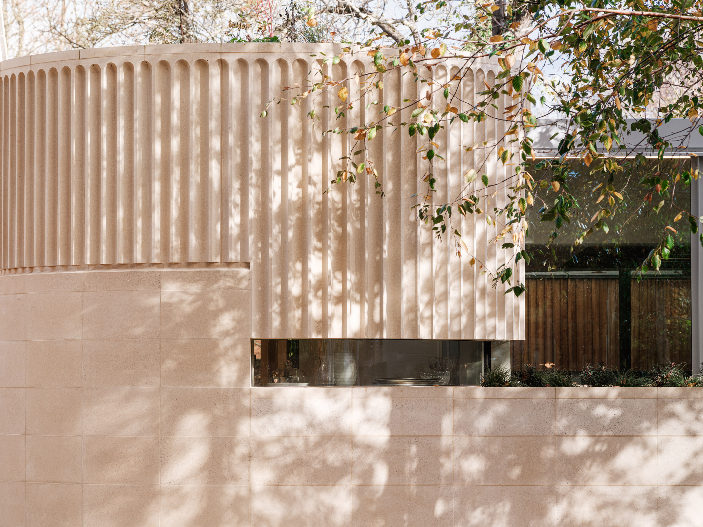 fluted concrete and stone facade