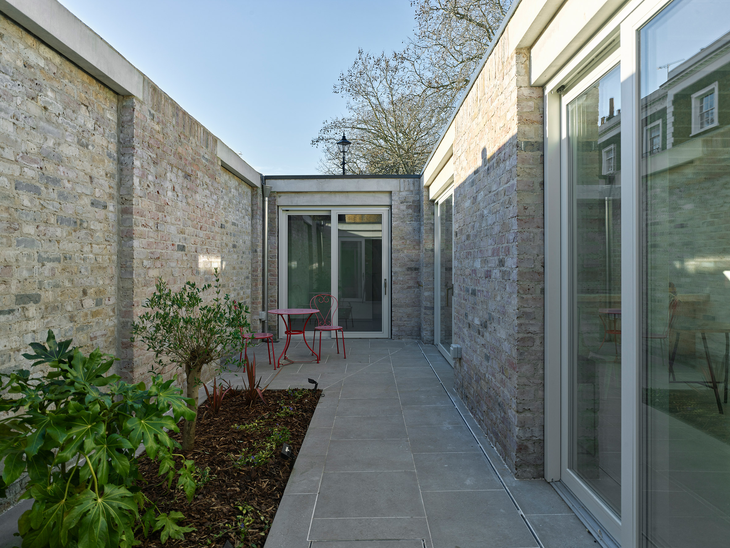 Garden walls conceal compact London house by Inglis Badrashi Loddo, comments update